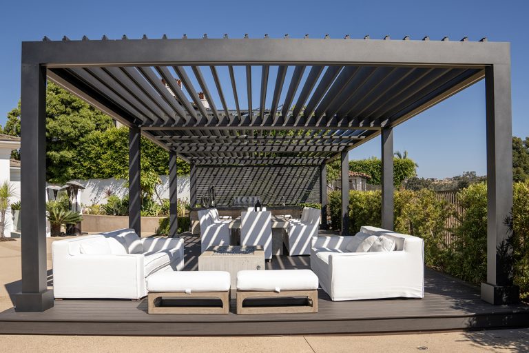 louvred roof pergola installed in a modern outdoor living area with adjustable shade panels