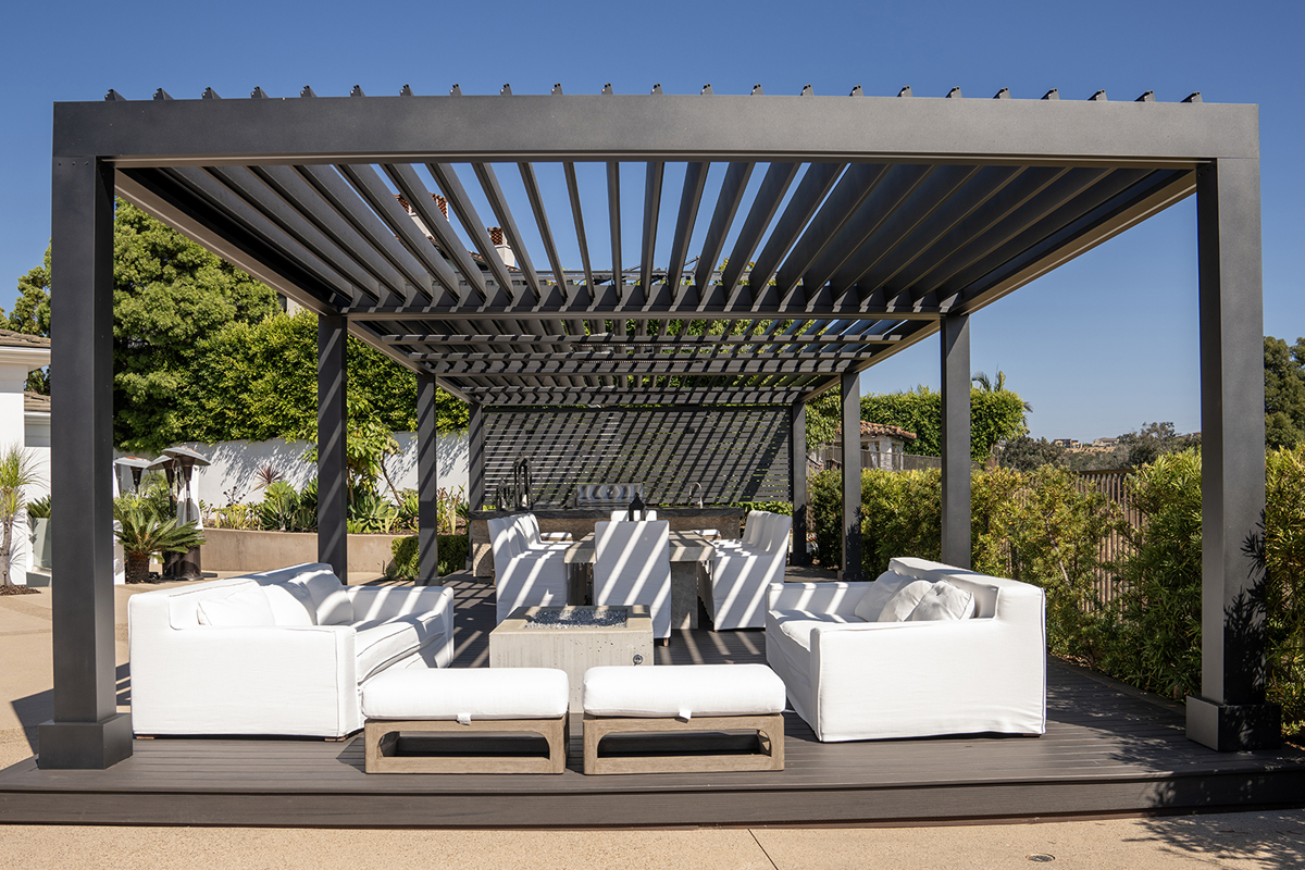 louvred roof pergola installed in a modern outdoor living area with adjustable shade panels